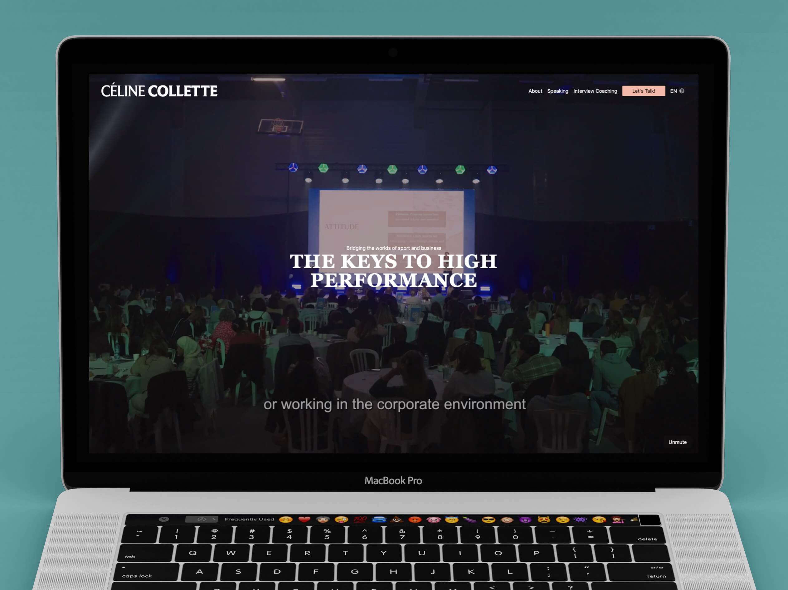 A prototype of Celine Colette's website on a mac book laptop, on a blue background.